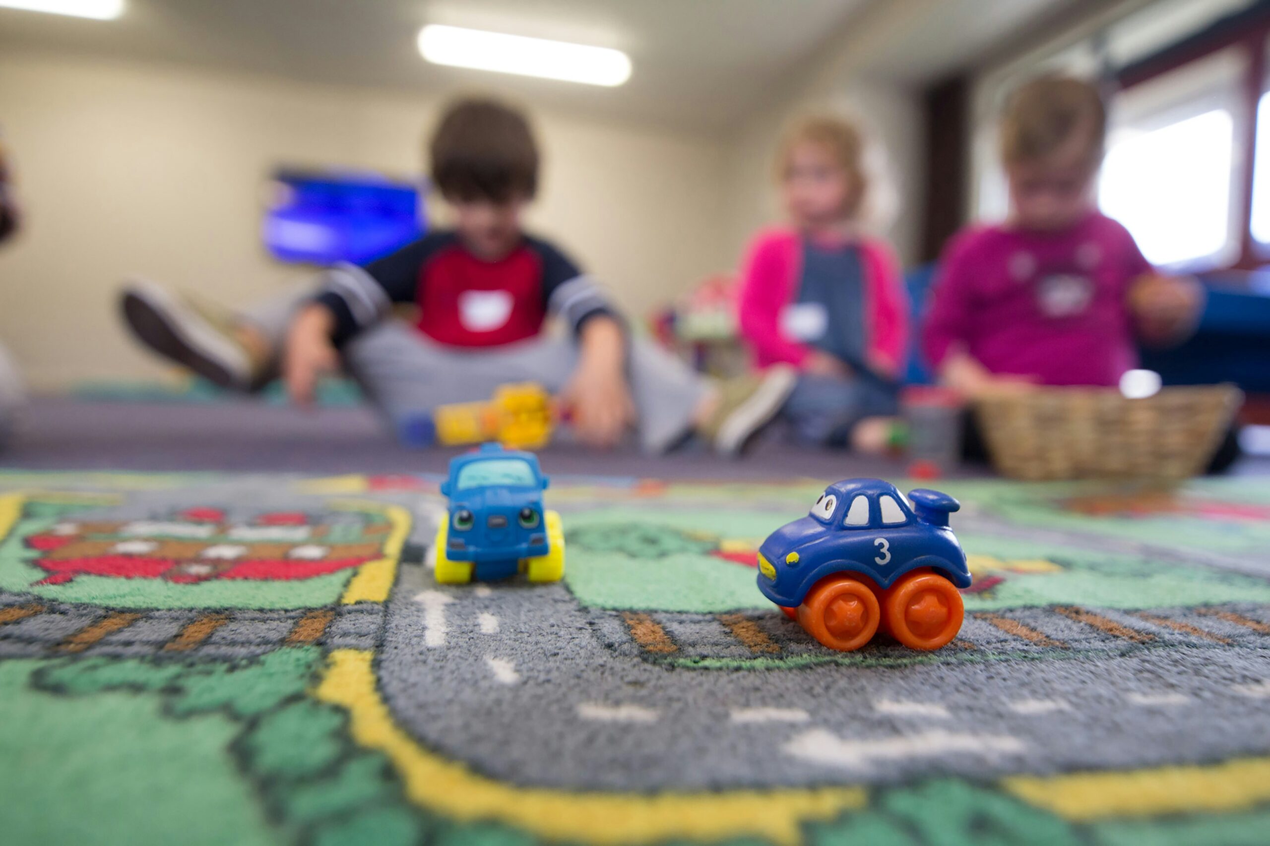 Children playing with toys in childcare center