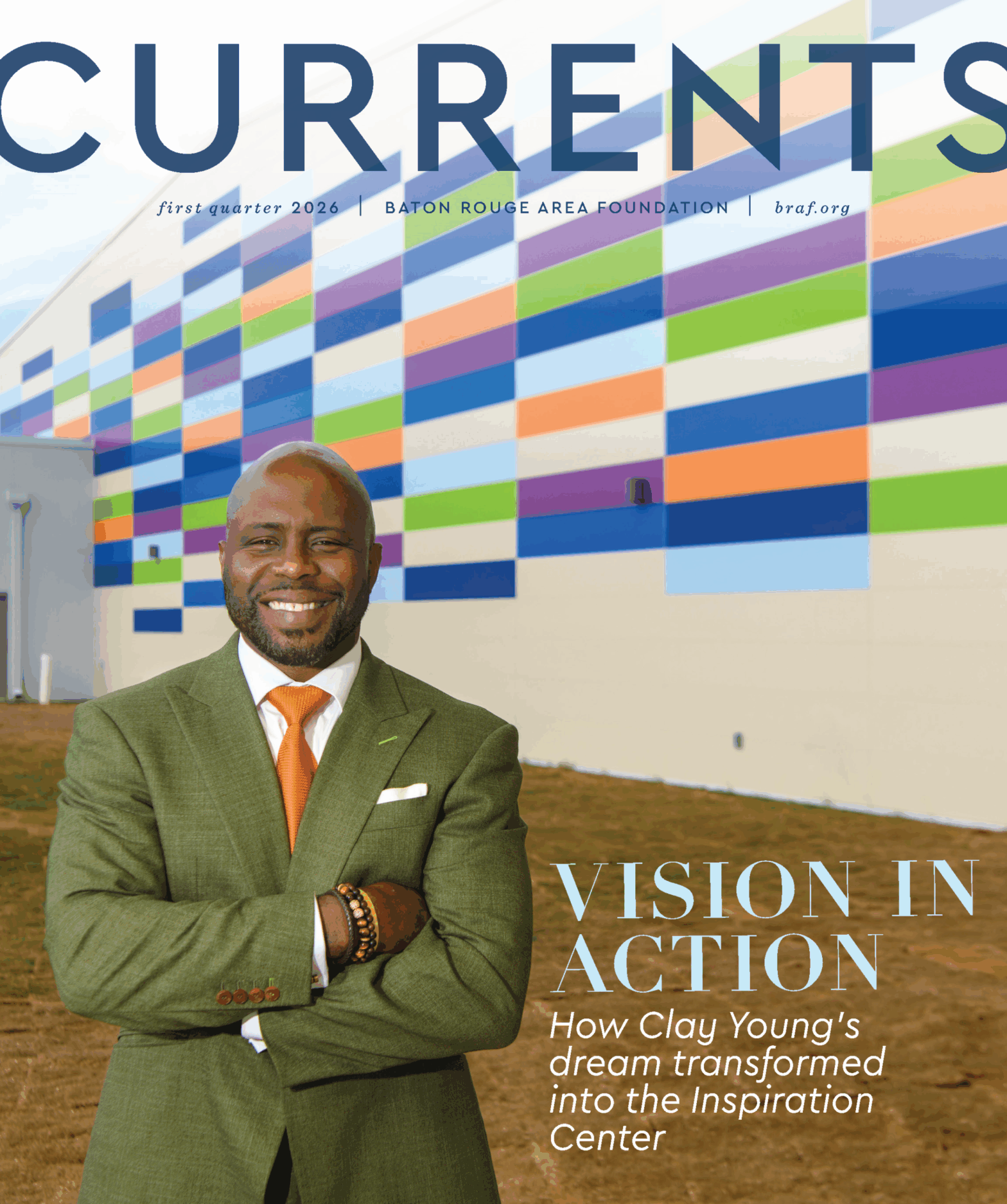 Currents magazine cover showing Clay Young infront of the Inspiration Center