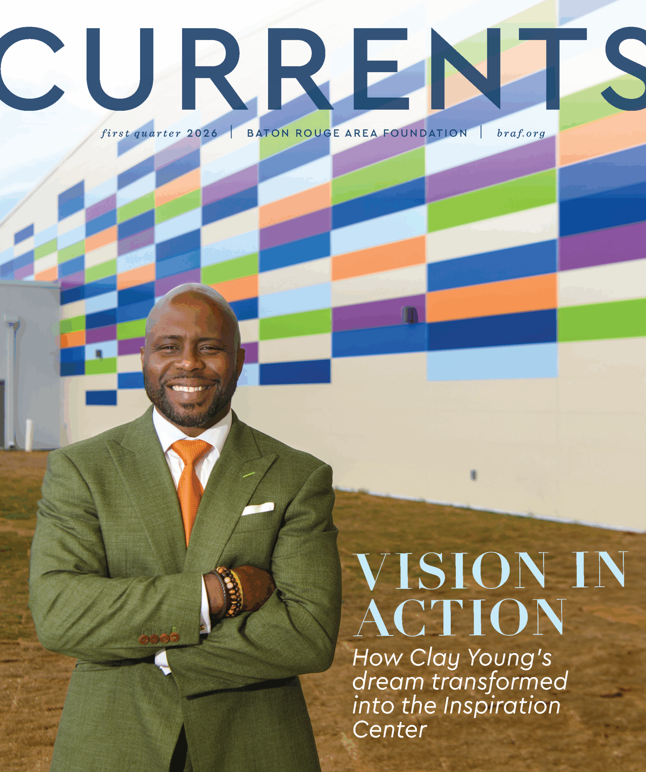 Currents magazine cover showing Clay Young infront of the Inspiration Center